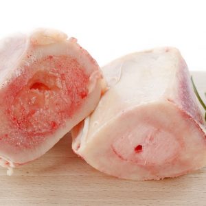 16086382 – beef bone marrow with rosemary on a cutting board