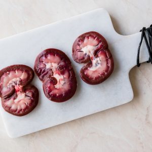 Sliced Raw Lamb Kidney on Marble Board.