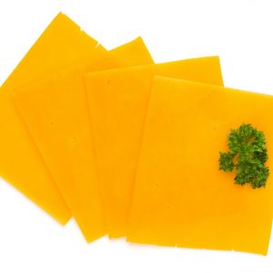 Cheddar cheese slice isolated on the white background.