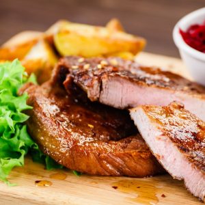 Grilled beefsteak with baked potatoes and beetroots